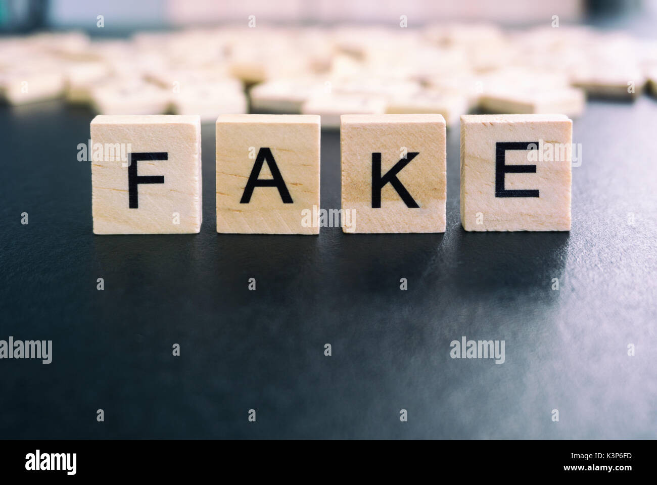 Fake words on a wood blocks, focus on the foreground with filter and
