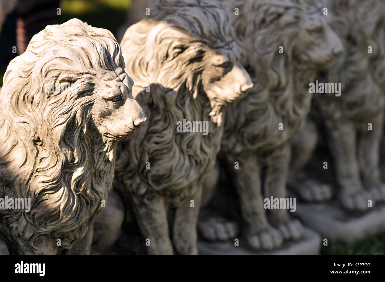 Concrete lions at a garden centre garden ornaments lions in a row