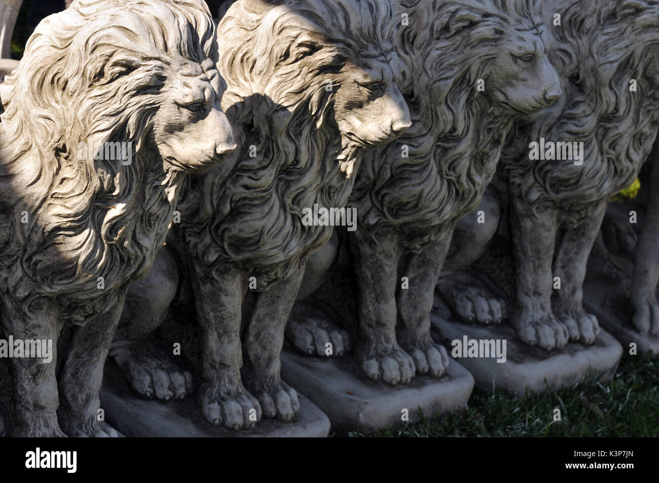 Concrete lions at a garden centre garden ornaments lions in a row