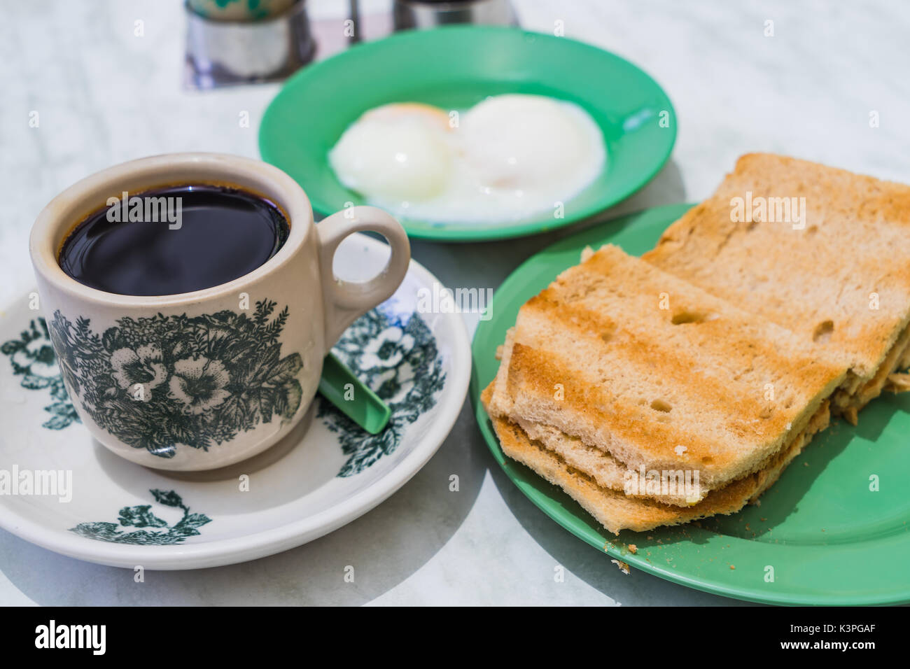 Singapore Breakfast called Kaya Toast, Coffee bread and Halfboiled eggs, Chinese coffee in