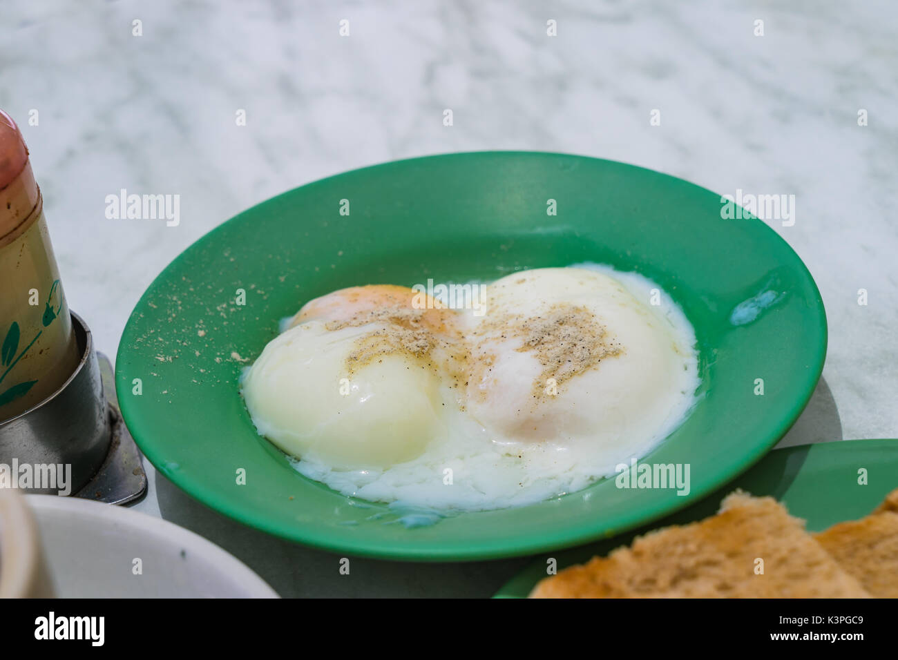 Halfboiled eggs, Traditional Singapore Breakfast called Kaya Toast