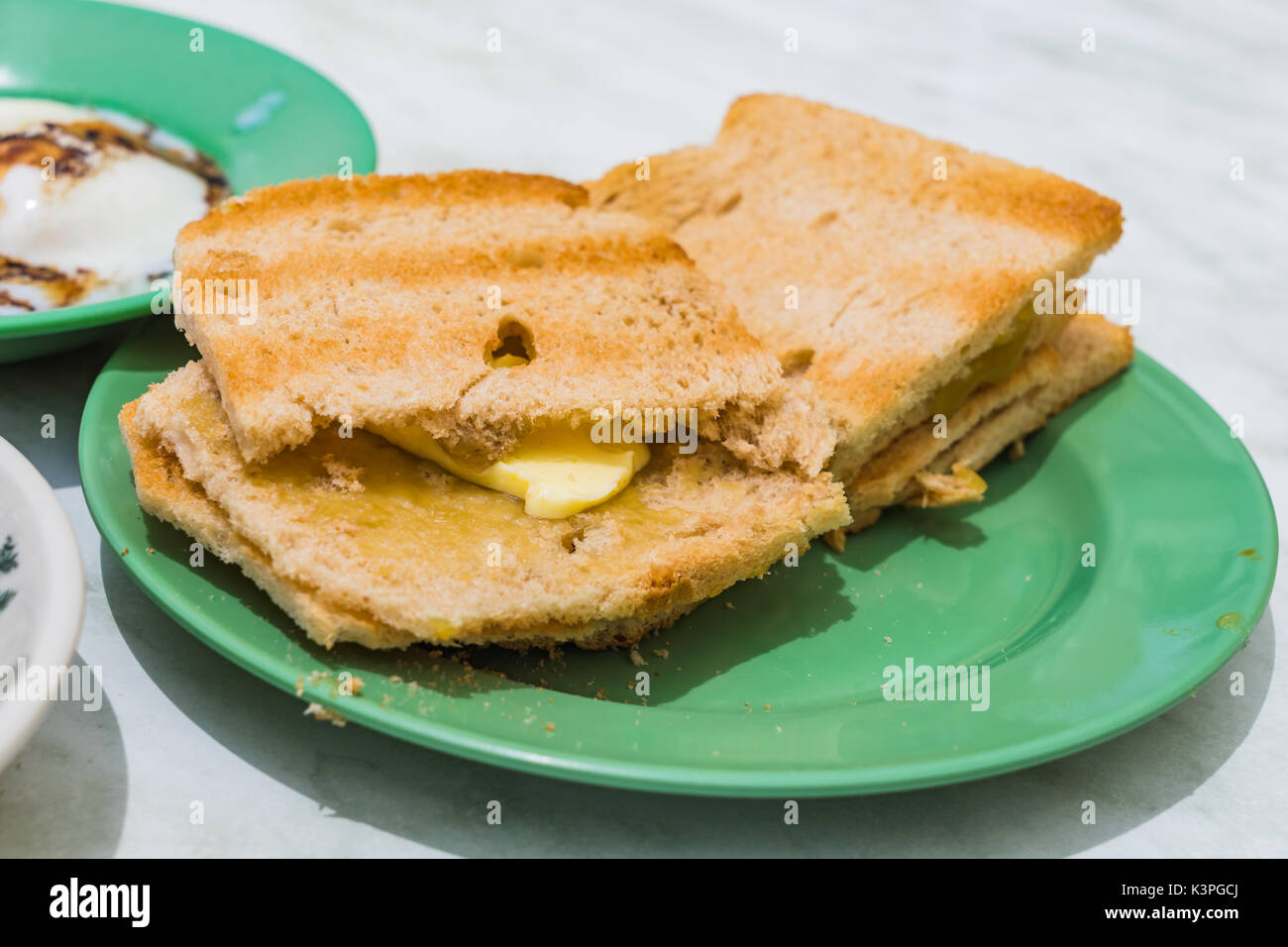 Traditional Singapore Breakfast called Kaya Toast, Bread with Coconut