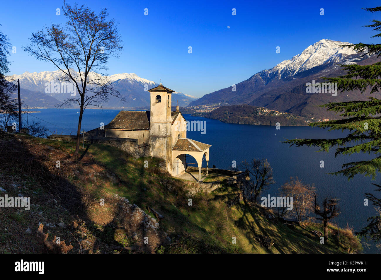 Chiesa di Sant'Eufemia, a little church over Musso surrounded by Como lake scenery, Province of Como, Lombardy, Italy Stock Photo