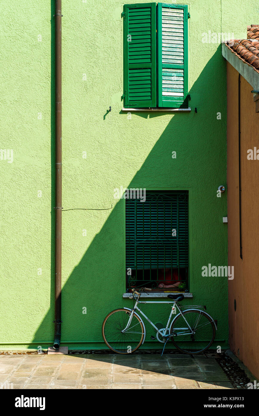 Comacchio, Ferrara, Emilia Romagna, Italy, Europe. Street detail in Comacchio with green windows. Stock Photo