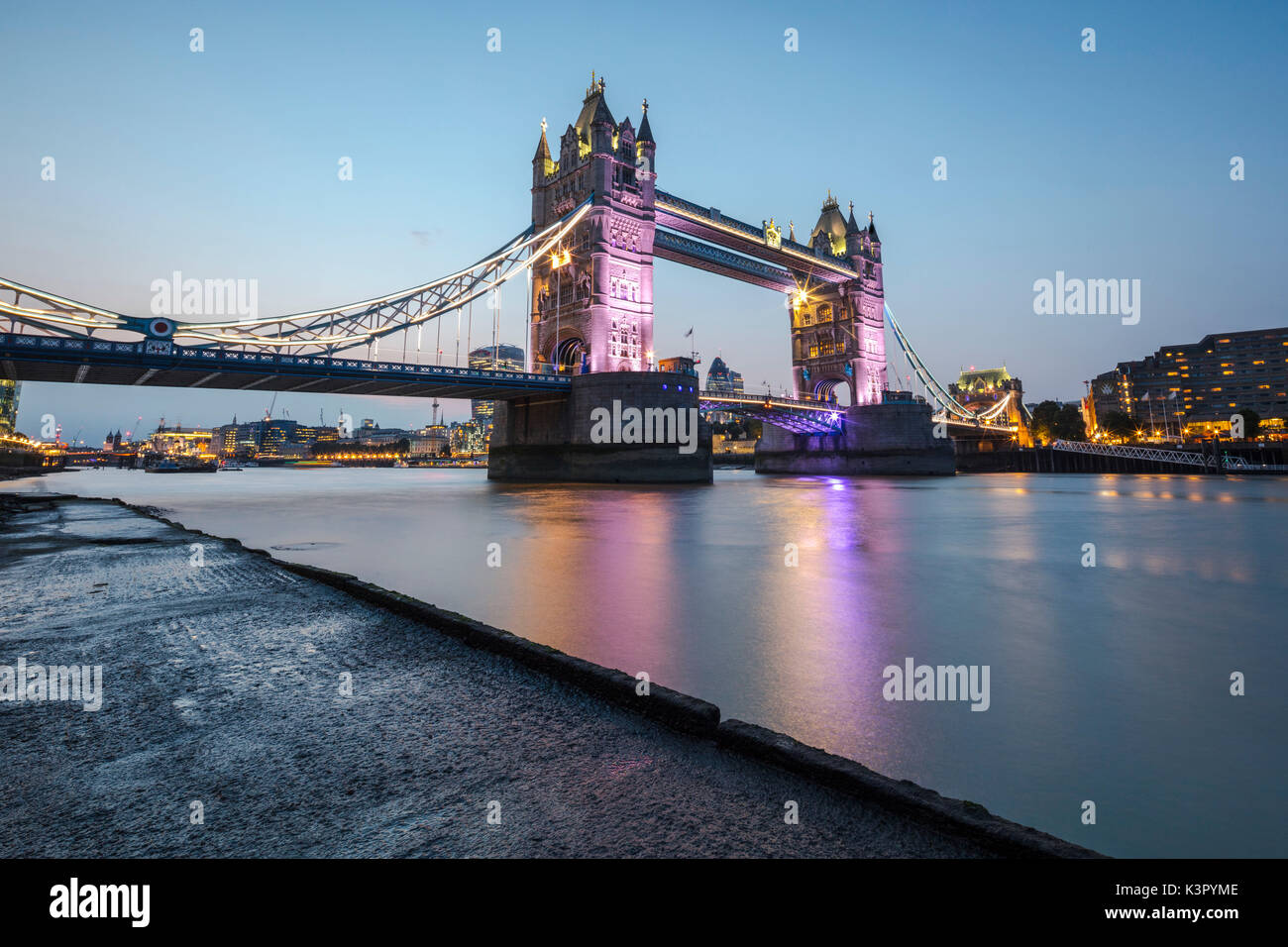 Night view of the Tower Bridge reflected in river Thames London United Kingdom Stock Photo