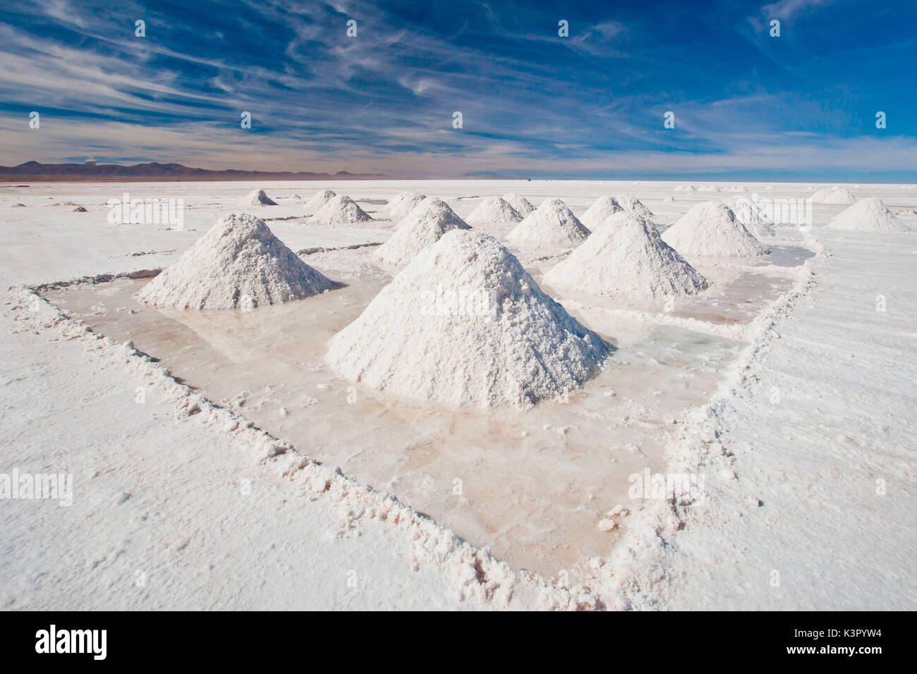 Pyramids of salt drying by Uyuni, a small village giving its name to the whole salt flat Bolivia South America Stock Photo