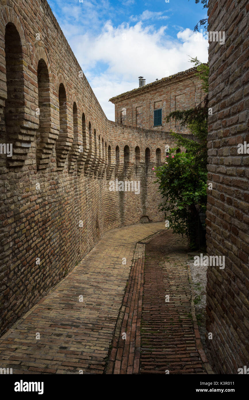 A typical alley and medieval walls of the old town of Corinaldo Province of Ancona Marche Italy Europe Stock Photo