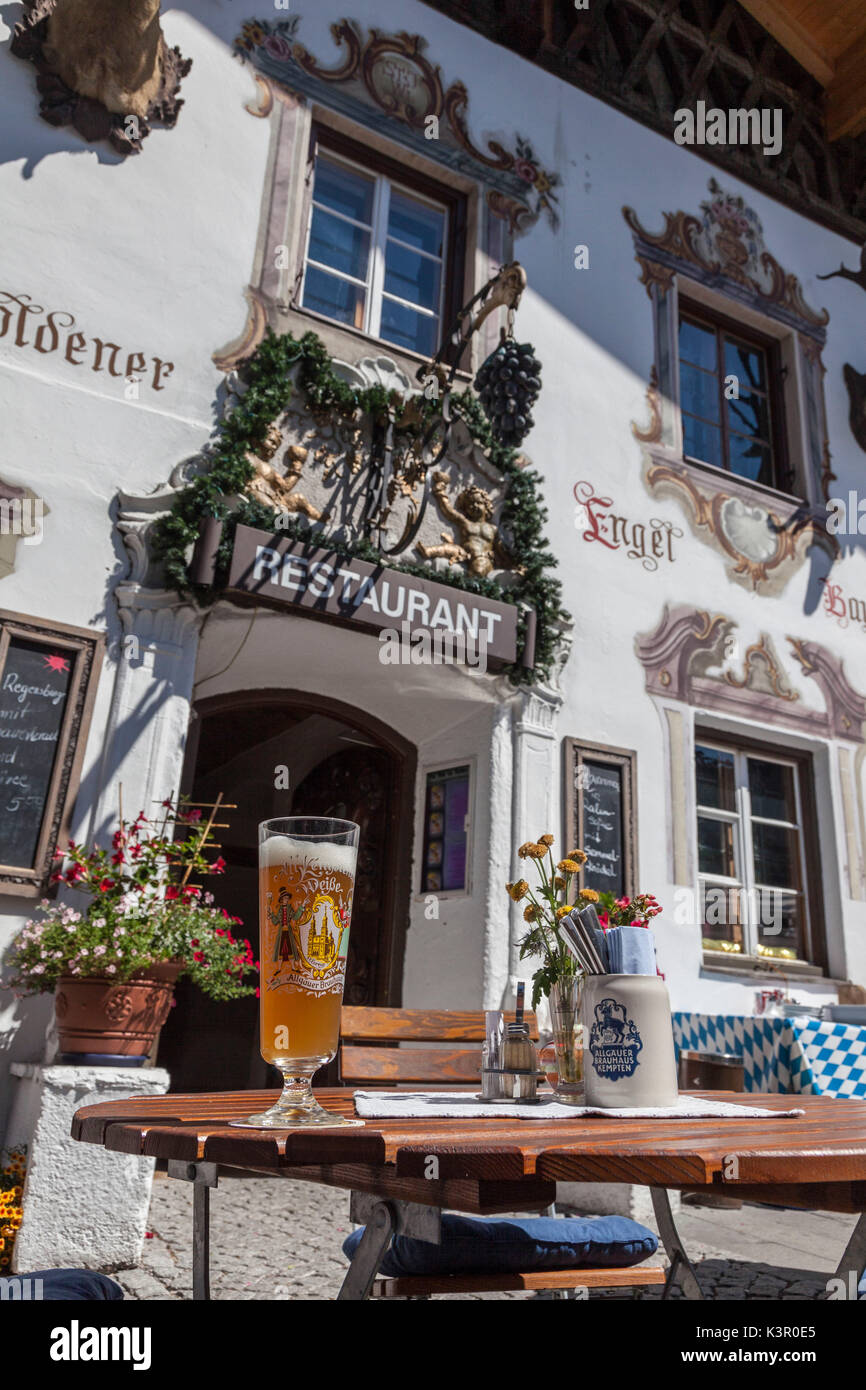 A typical alpine restaurant and glass of German beer Garmisch Partenkirchen Oberbayern region Bavaria Germany Europe Stock Photo