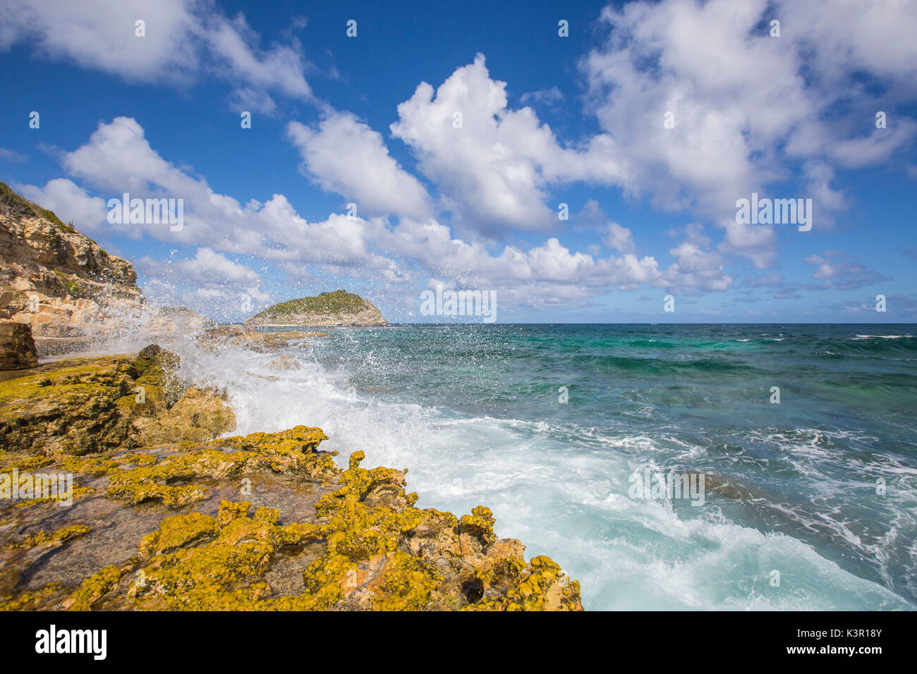 The waves of Caribbean sea crashing on the cliffs Half Moon Bay Antigua and Barbuda Leeward Island West Indies Stock Photo