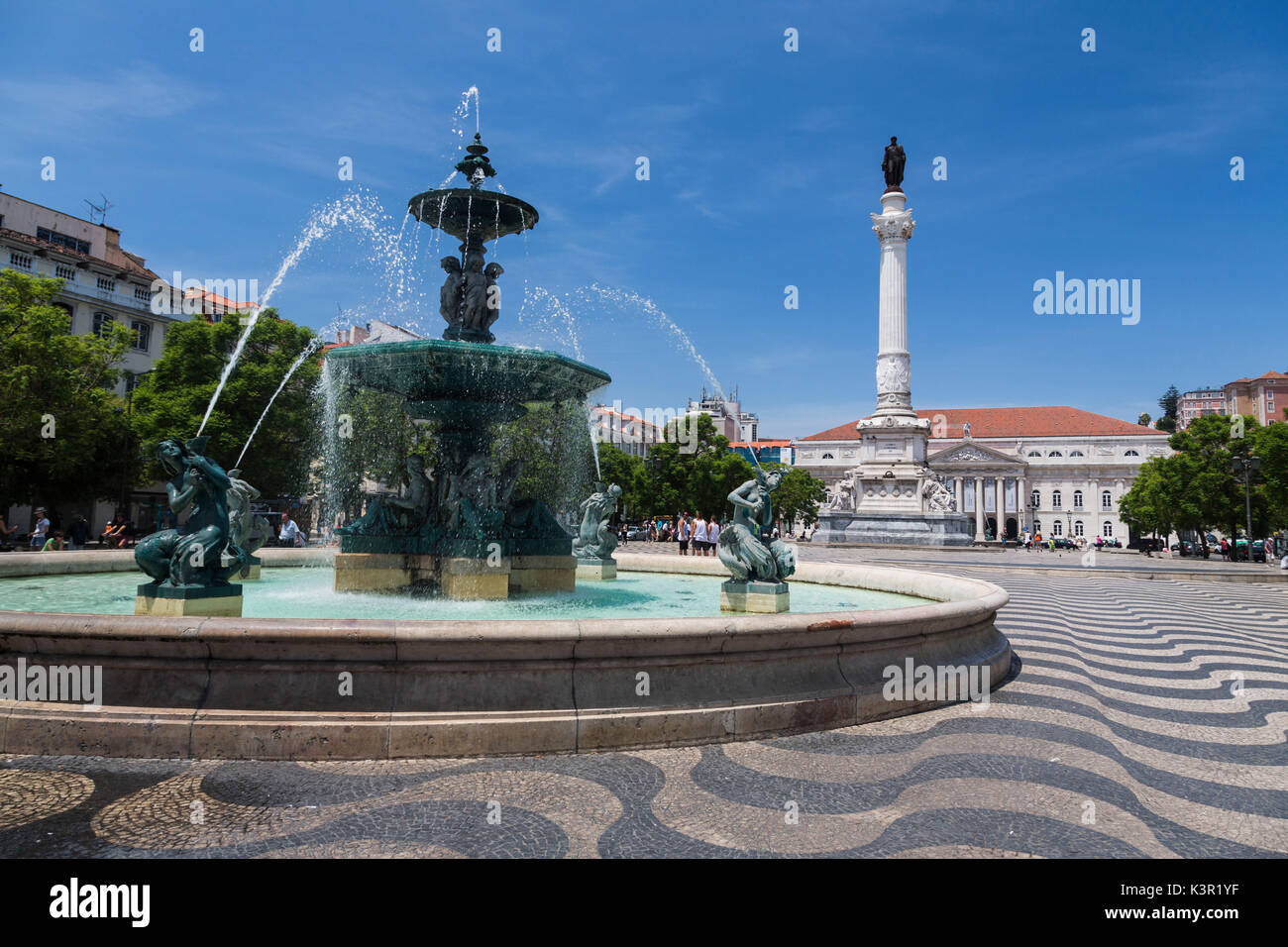 Fountain frames the old palace in Praça Dom Pedro IV also known as Rossio Square Pombaline Downtown of Lisbon Portugal Europe Stock Photo