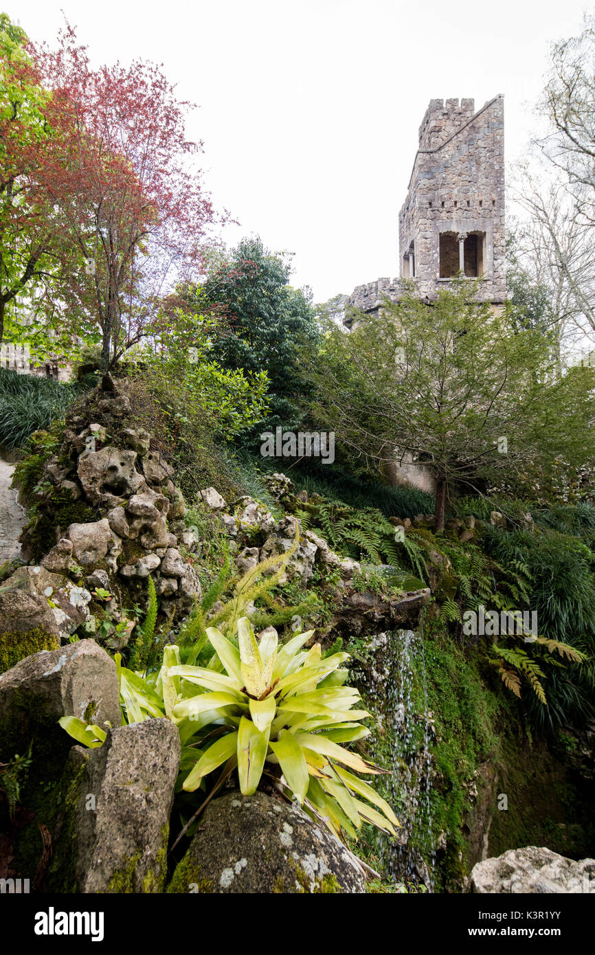 Old mystical tower of Romanesque Gothic and Renaissance style inside the park Quinta da Regaleira Sintra Portugal Europe Stock Photo