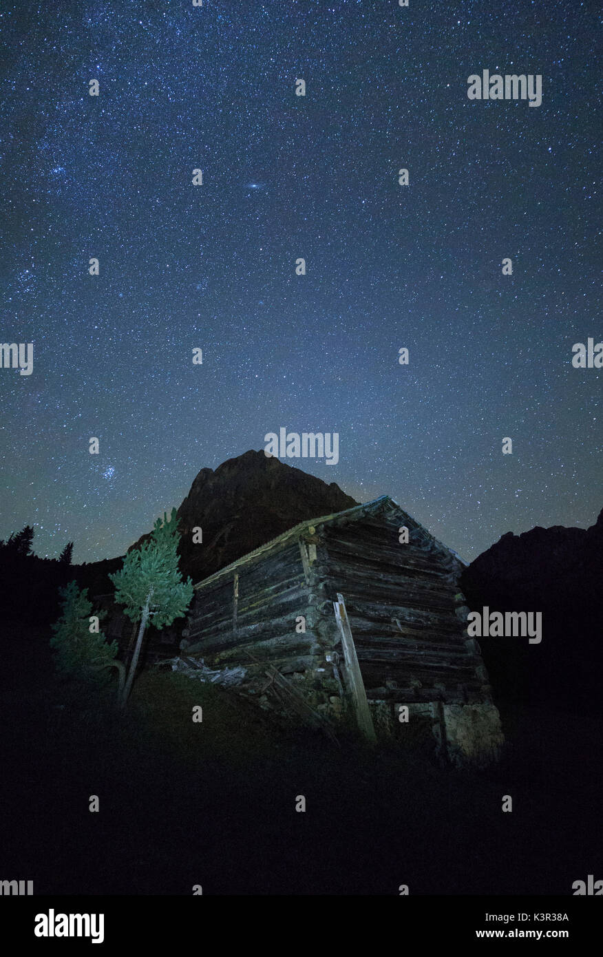 Starry night above the wooden hut Passo Delle Erbe Odle Dolomites Funes Valley Trentino Alto Adige South Tyrol Italy Europe Stock Photo