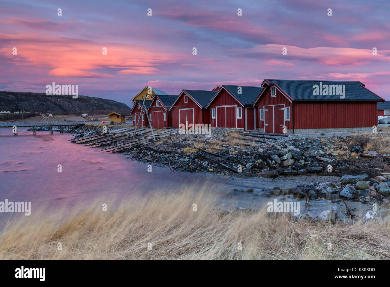 The colors of dawn light up the houses of fishermen Flatanger Trøndelag Norway Europe Stock Photo