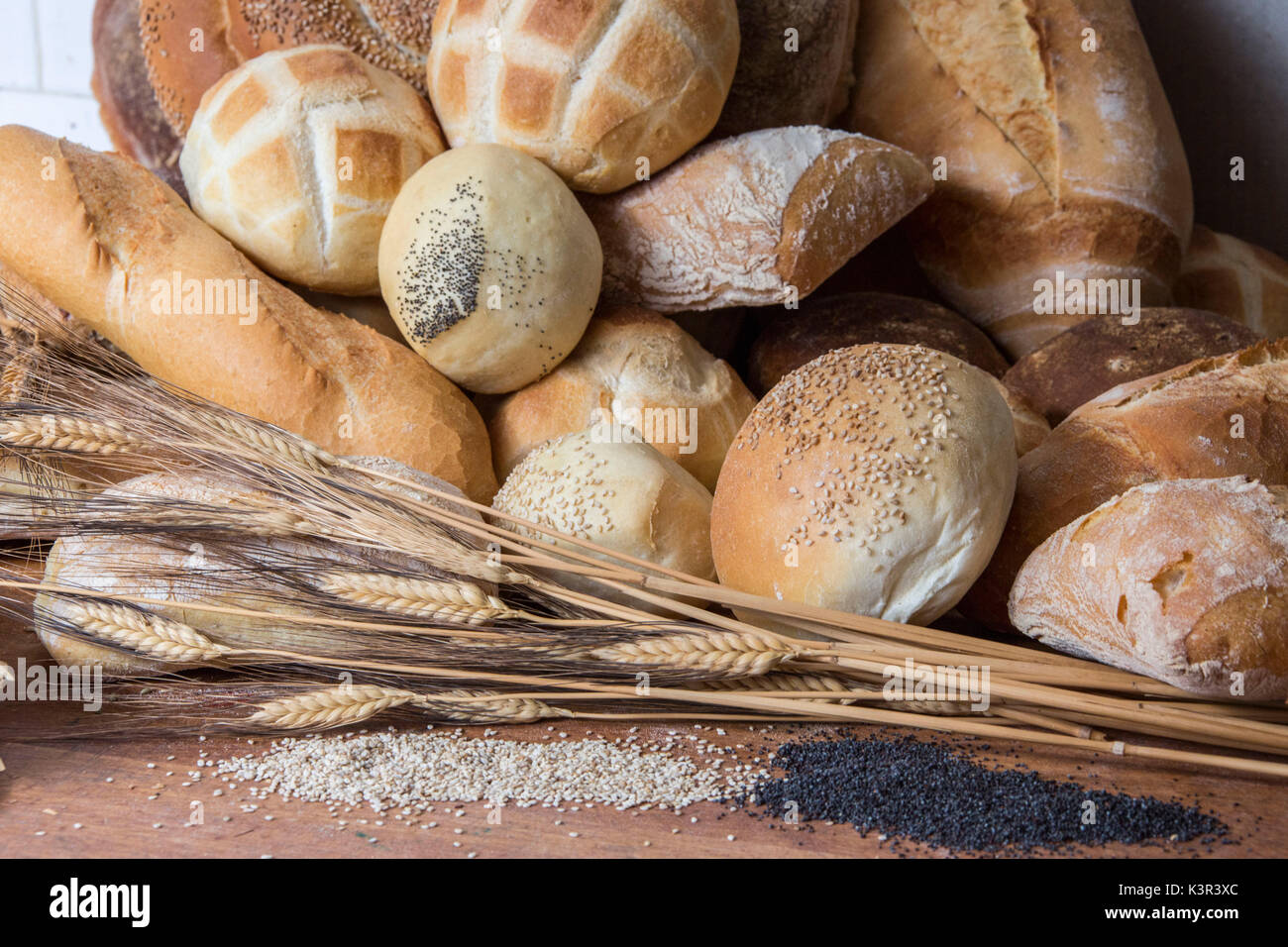 Artistic composition with the finished product bread and raw materials. Lombardy. Italy. Europe Stock Photo