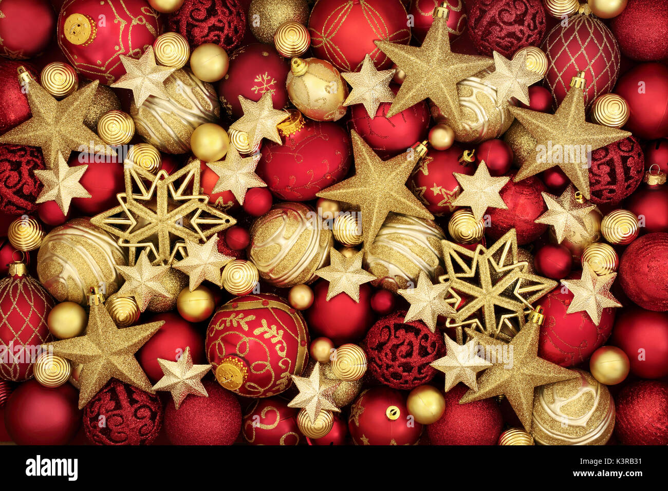 Christmas decorative background with red and gold bauble decorations ...