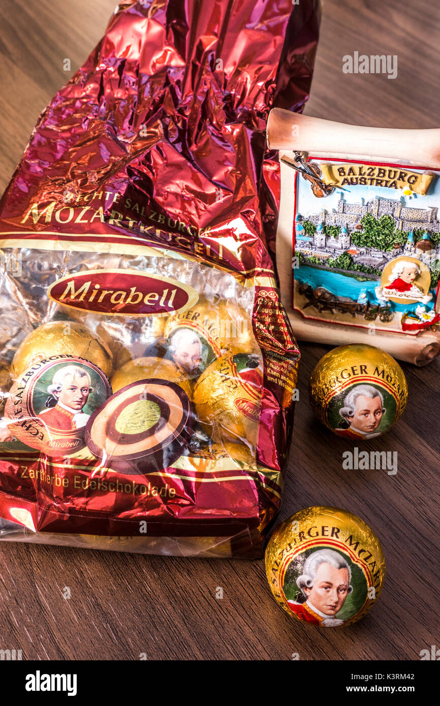 A Salzburg souvenir alongside a pack of Mirabell Mozartkugen Mozart chocolate balls - produced in the spirit of the original recipe in Salzburg. Stock Photo