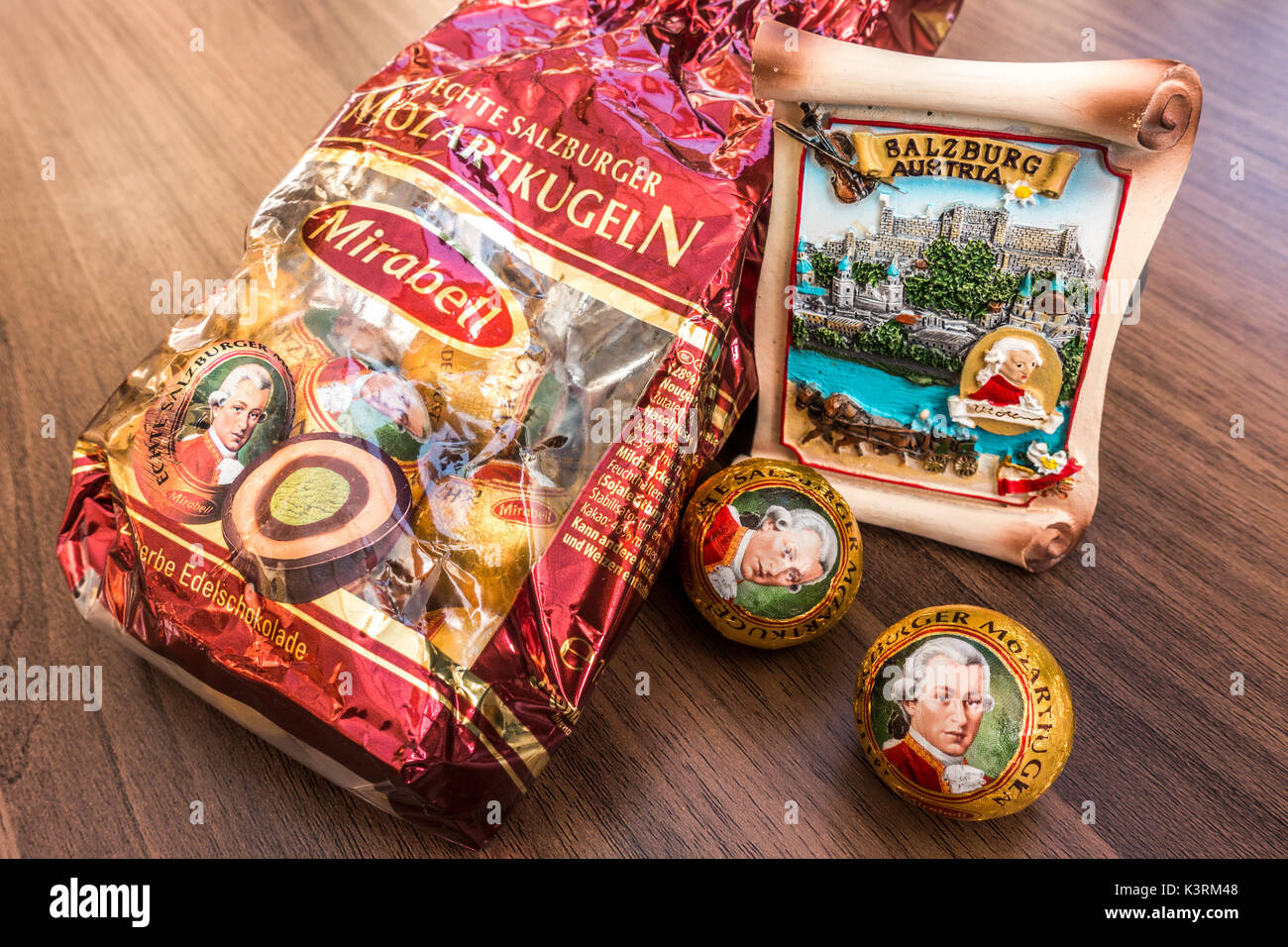 A Salzburg souvenir alongside a pack of Mirabell Mozartkugen Mozart chocolate balls - produced in the spirit of the original recipe in Salzburg. Stock Photo