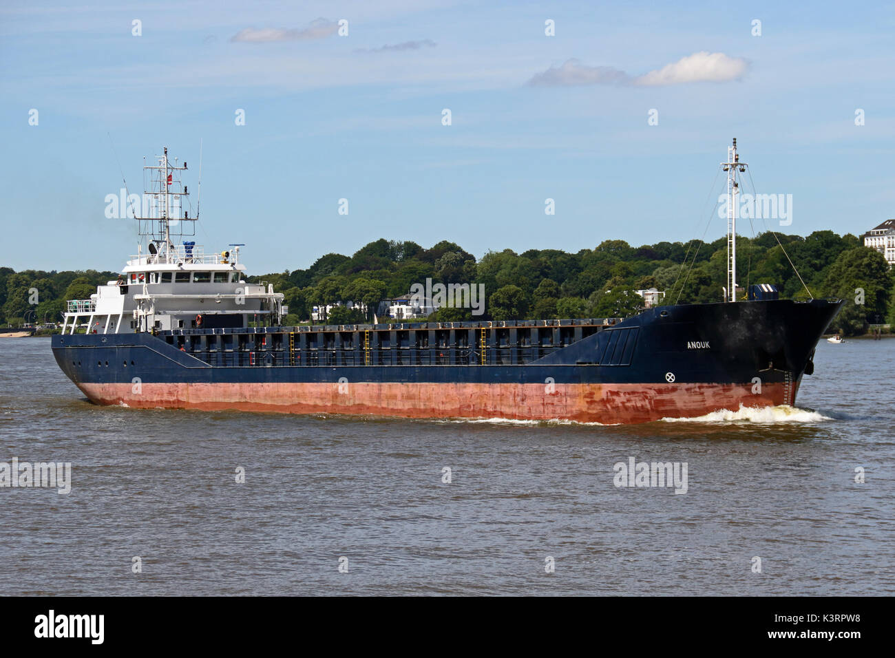 The cargo ship Anouk enters the Port of Hamburg. Stock Photo