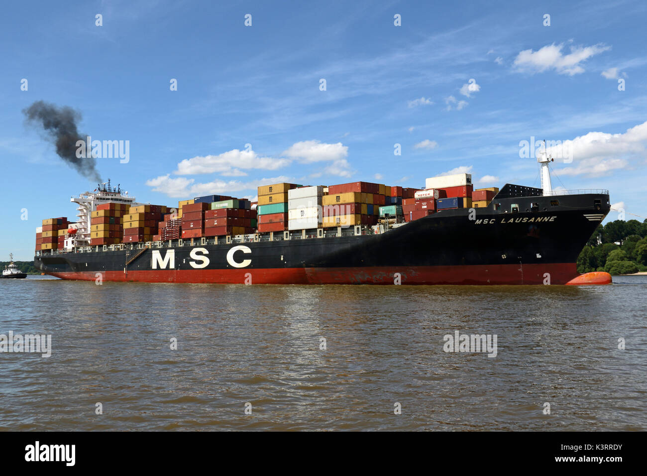 The container ship MSC Lausanne reaches the Port of Hamburg. Stock Photo