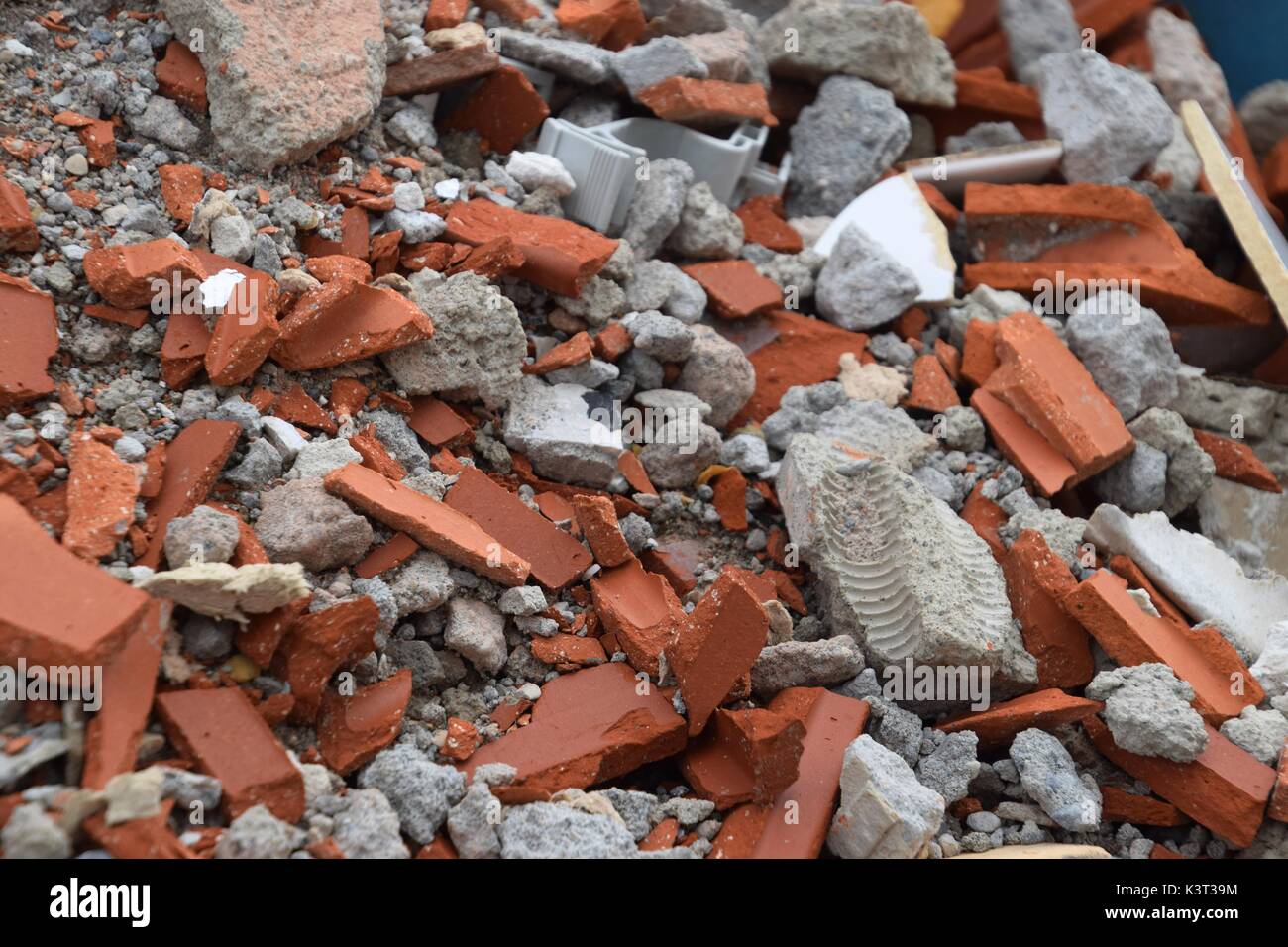 constructions waste consists of unwanted material produced dirctly or incidentally by the construction of industries, includes building materials Stock Photo