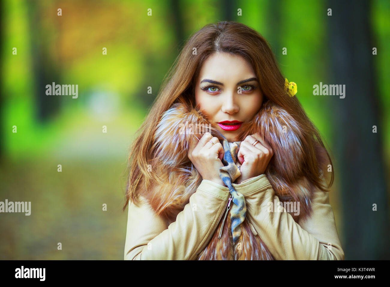 beautiful young woman in the autumn park outdoor Stock Photo - Alamy