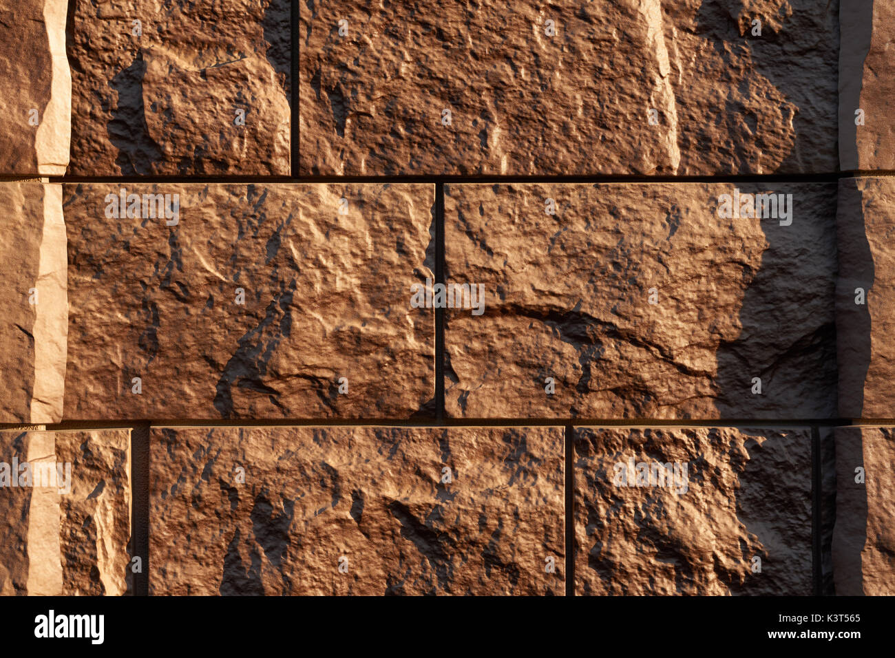 Artificial stone textured finishing on the foundation of the house ...