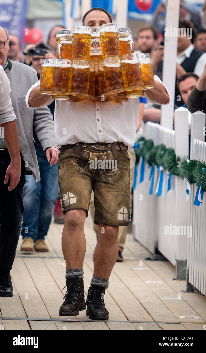 Abensberg, Germany. 3rd Sep, 2017. dpatop - Oliver Struempfel can be seen during his world record attempt at carrying 27 beer mugs at the traditional festival Gillamoos in Abensberg, Germany, 3 September 2017. He succeeded in his feat. Photo: Matthias Balk/dpa/Alamy Live News Stock Photo