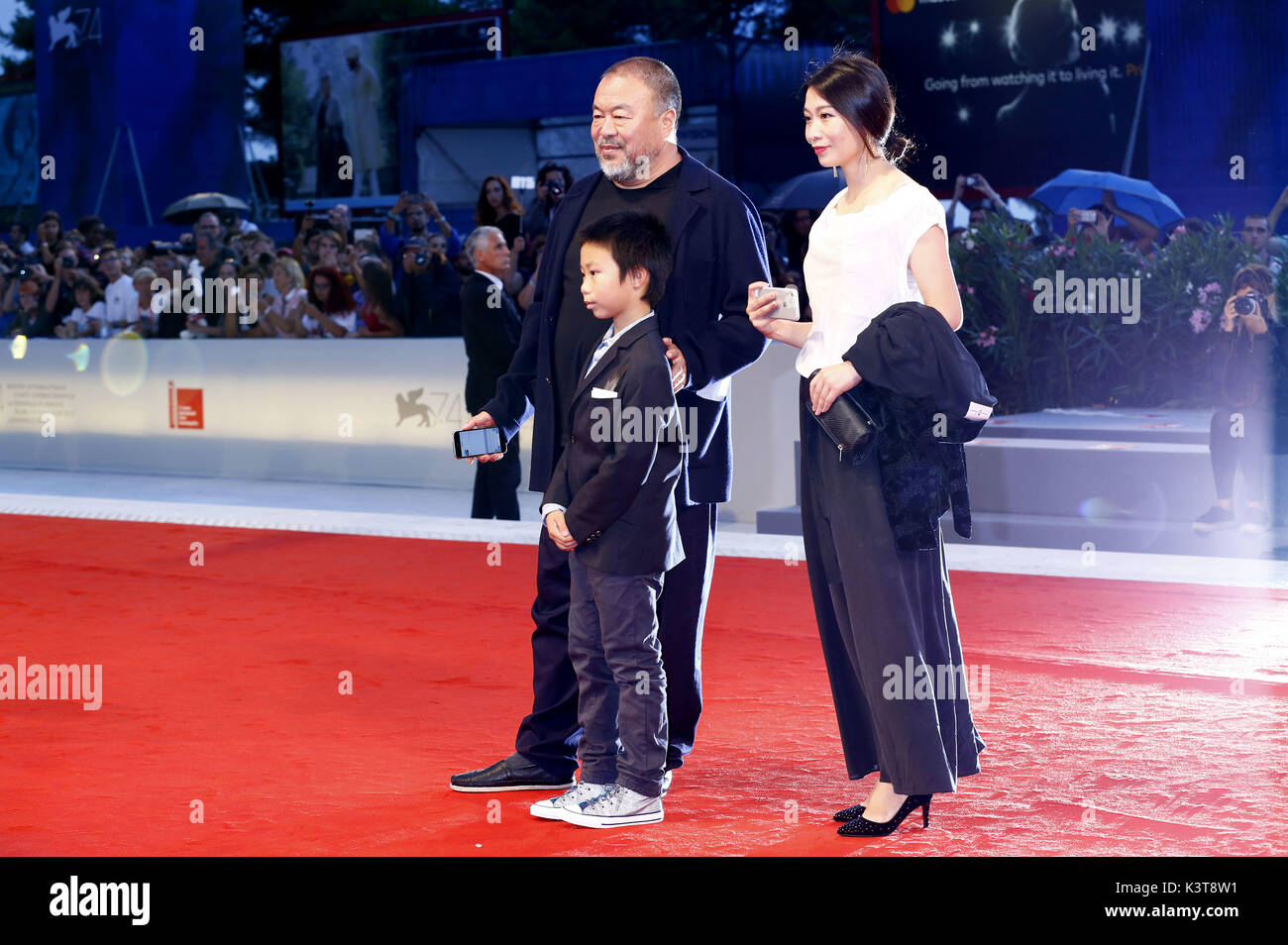 Venice, Italy. 01st Sep, 2017. Ai Weiwei with his wife Lu Qing and his son Ai Lao ttending the 'Human Flow' premiere at the 74th Venice International Film Festival at the Palazzo del Cinema on September 01, 2017 in Venice, Italy | usage worldwide Credit: dpa/Alamy Live News Stock Photo