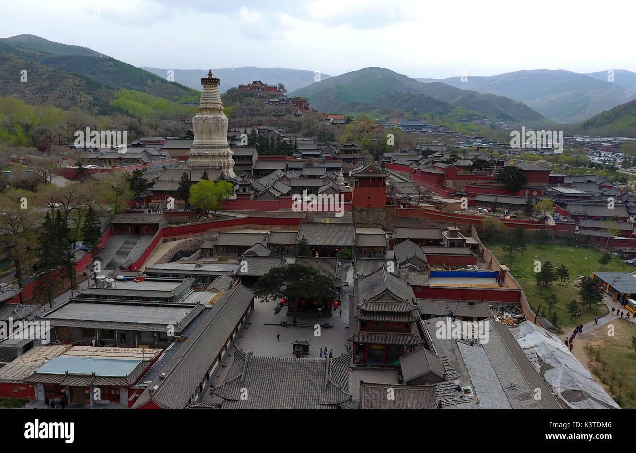 Mount Wutai. 9th May, 2017. Photo taken on May 9, 2017 shows an aerial view of temples on Mount Wutai, one of four sacred Buddhist mountains in China, in north China's Shanxi Province. Added to UNESCO's World Heritage List in 2009, Mount Wutai is home to over 50 Buddhist temples. Credit: Cao Yang/Xinhua/Alamy Live News Stock Photo