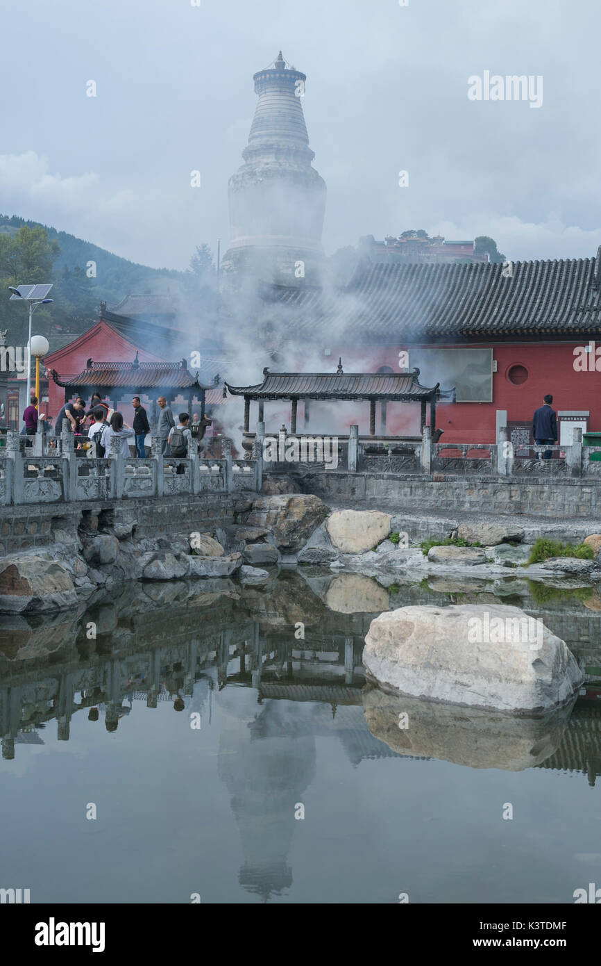 Mount Wutai, China's Shanxi Province. 1st Sep, 2017. People pray for good fortune outside the Wuye Temple on Mount Wutai, one of four sacred Buddhist mountains in China, in north China's Shanxi Province, Sept. 1, 2017. Added to UNESCO's World Heritage List in 2009, Mount Wutai is home to over 50 Buddhist temples. Credit: Ma Ping/Xinhua/Alamy Live News Stock Photo