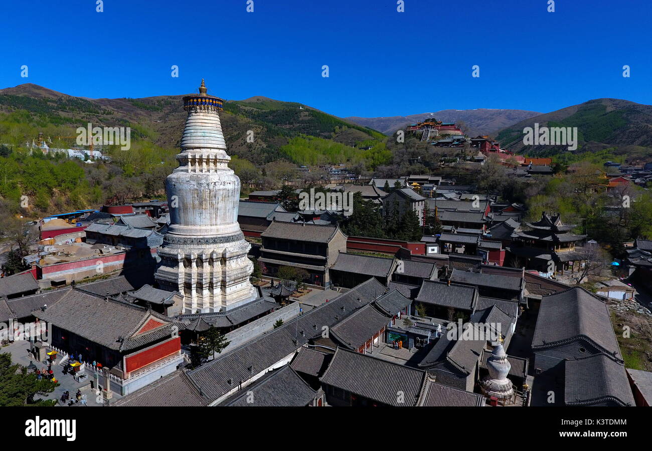 Mount Wutai. 9th May, 2017. Photo taken on May 9, 2017 shows an aerial view of Tayuan Temple on Mount Wutai, one of four sacred Buddhist mountains in China, in north China's Shanxi Province. Added to UNESCO's World Heritage List in 2009, Mount Wutai is home to over 50 Buddhist temples. Credit: Cao Yang/Xinhua/Alamy Live News Stock Photo