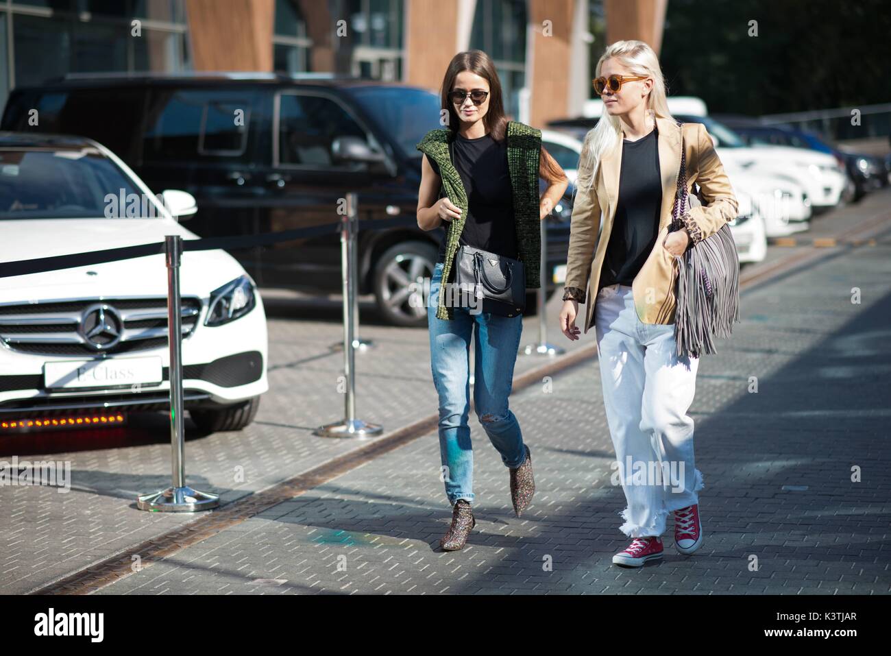 Chic showgoers walking outside Mercedes Benz Kiev Fashion Days - Aug 31, 2017 - Photo: Runway Manhattan/Michelle Sangster***For Editorial Use Only*** | usage worldwide Stock Photo