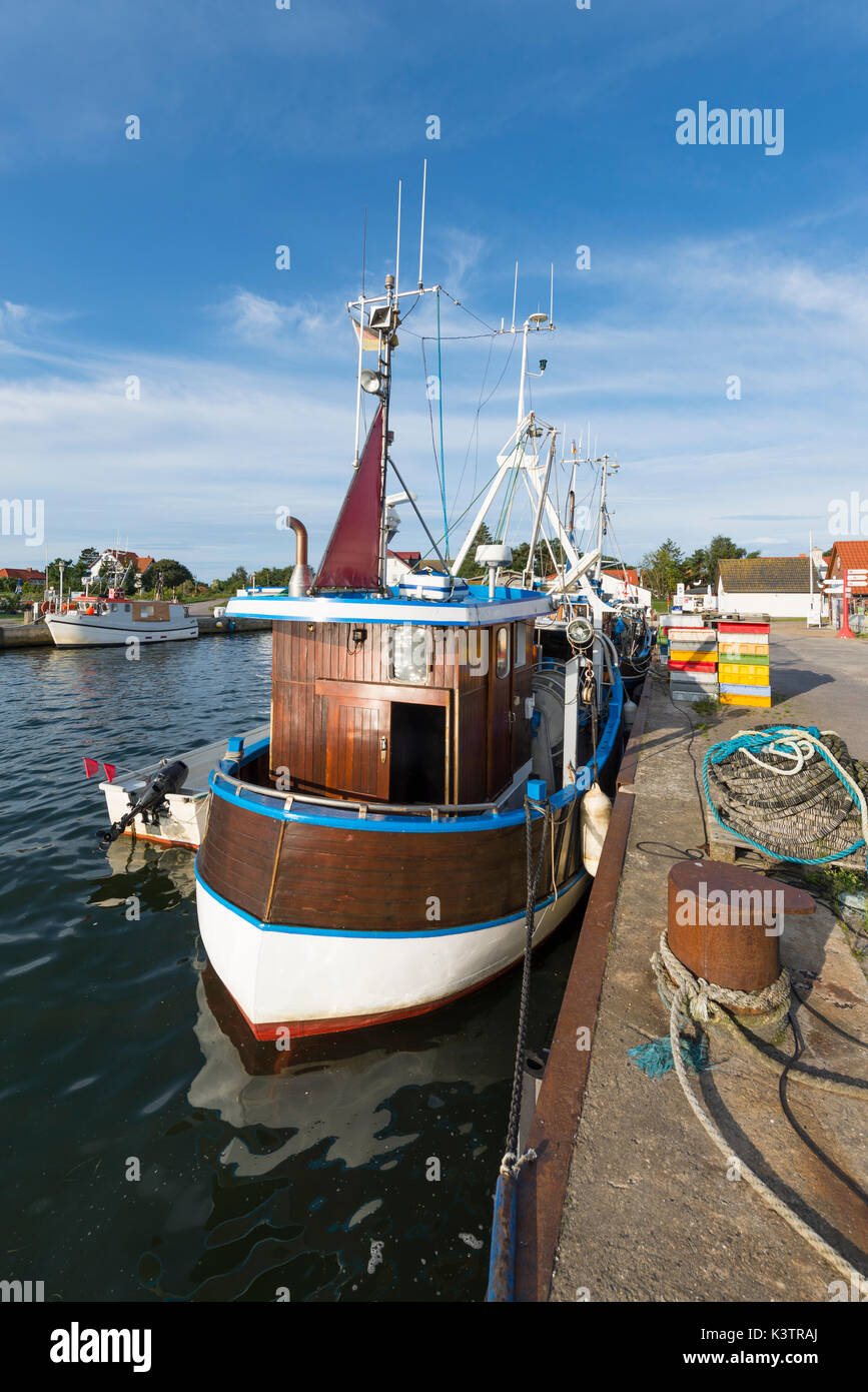 Moored timber fishing boat in the harbor of Vitte on the island Hiddensee in the morning sun, Mecklenburg-West Pomerania, Germany Stock Photo