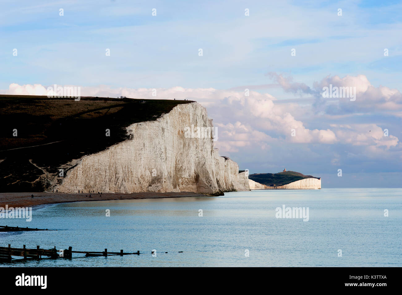 A dramatic view of the Seven Sisters, a series of white chalk cliffs by the English Channel. They form part of the South Downs in East Sussex, England Stock Photo