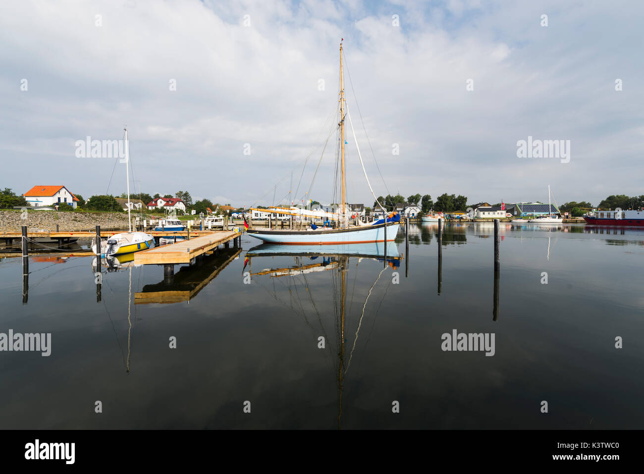 Wooden pale blue sailing boat in the harbor of Vitte on the island Hiddensee, Mecklenburg-West Pomerania, Germany Stock Photo