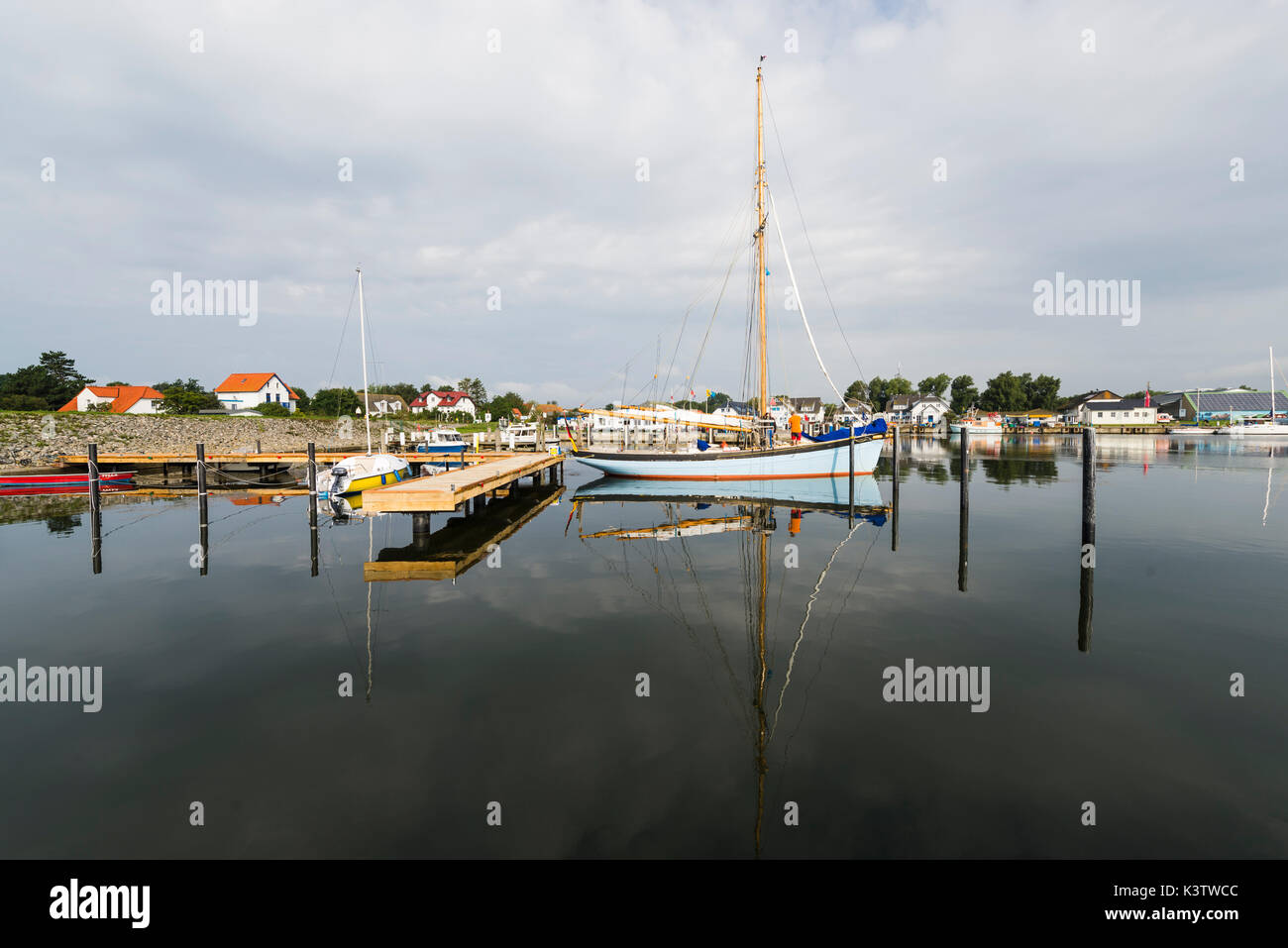Wooden pale blue sailing boat in the harbor of Vitte on the island Hiddensee, Mecklenburg-West Pomerania, Germany Stock Photo