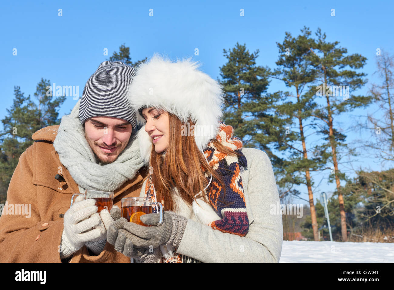Couple in love drinks tea during their winter holiday relaxation trip Stock Photo