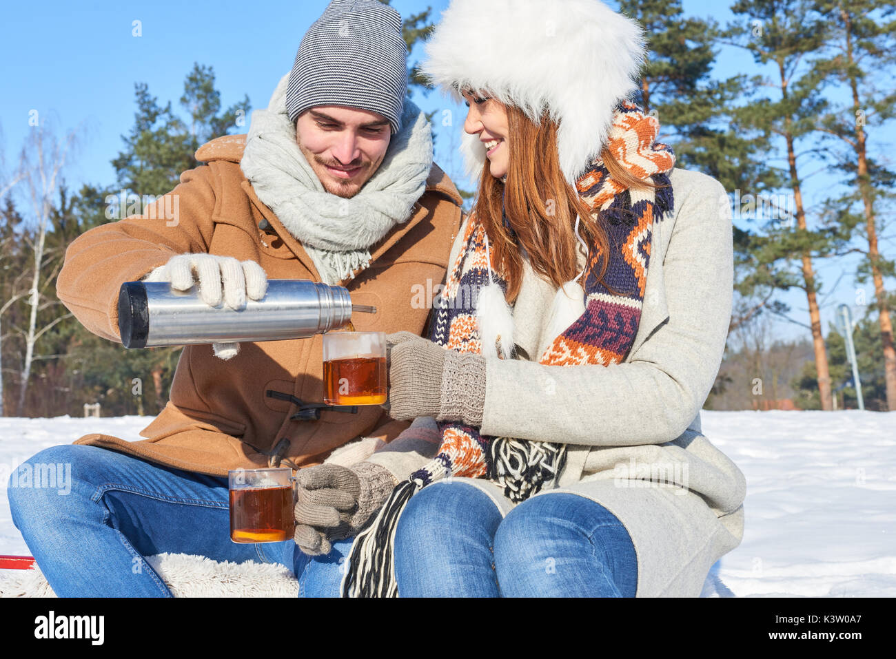 Couple take a break and drink hot tea for relaxation Stock Photo