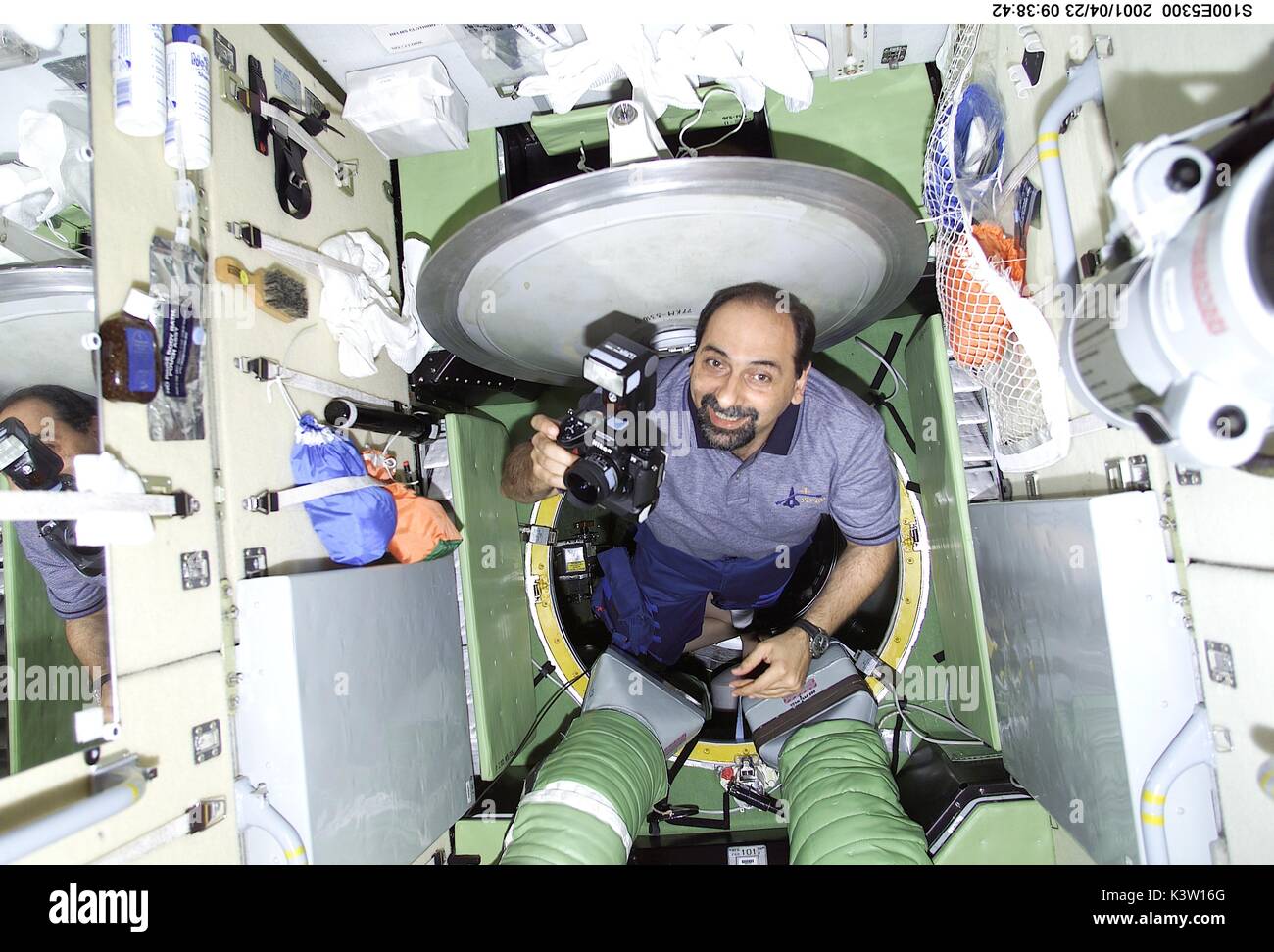 NASA Space Shuttle Endeavour STS-100 mission prime crew member Italian astronaut Umberto Guidoni of the European Space Agency emerges from the hatch in the Zvezda Service Module aboard the International Space Station April 23, 2001 in Earth orbit.  (photo by NASA Photo via Planetpix) Stock Photo