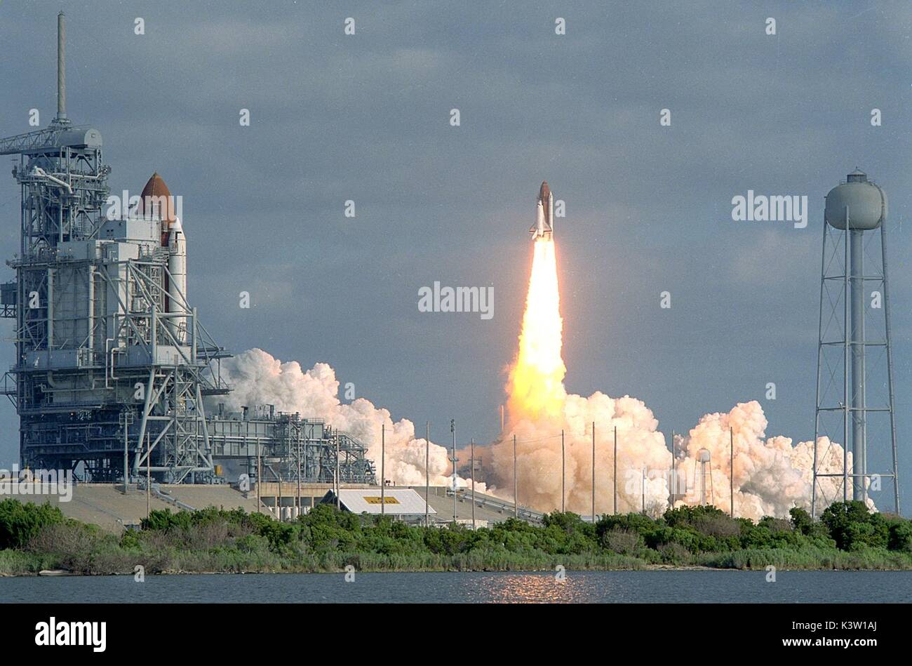 The NASA Space Shuttle Columbia (left) sits on the launch pad as the ...