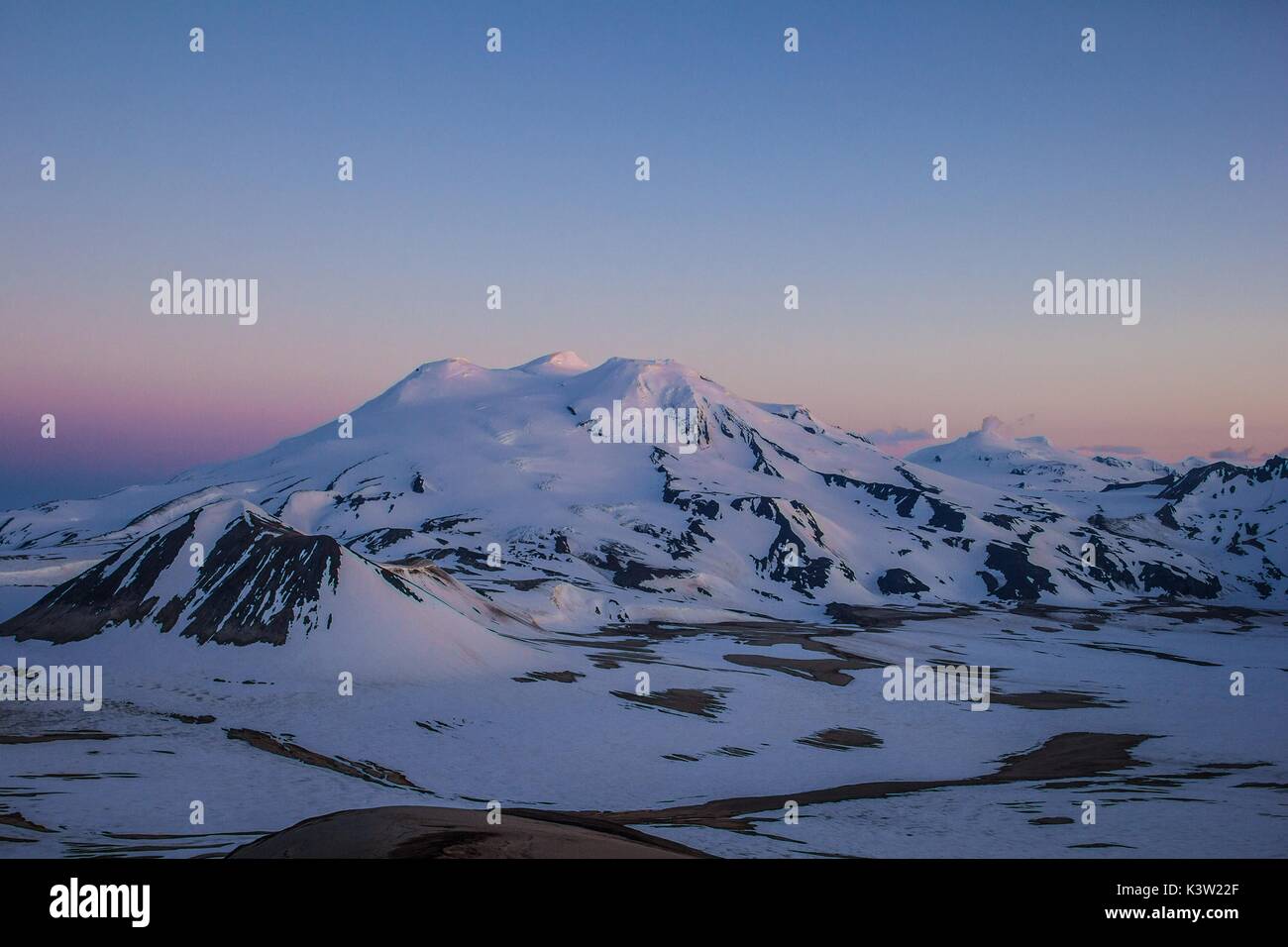 Steam plumes rise from the snow-covered Mount Mageik and Mount Martin volcanoes at the Katmai National Park and Preserve October 29, 2016 near King Salmon, Alaska.  (photo by Daniel Lombardi  via Planetpix) Stock Photo