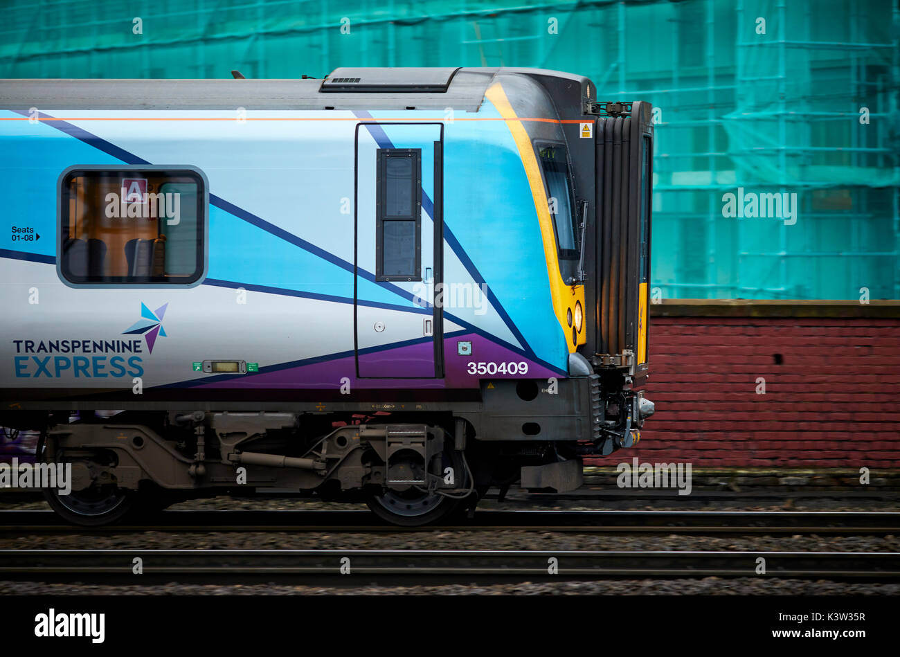 TransPennine Express multiple units franchise railway line from Ardwick leading to Manchester Piccadilly  station panning along West Coast Main Line W Stock Photo