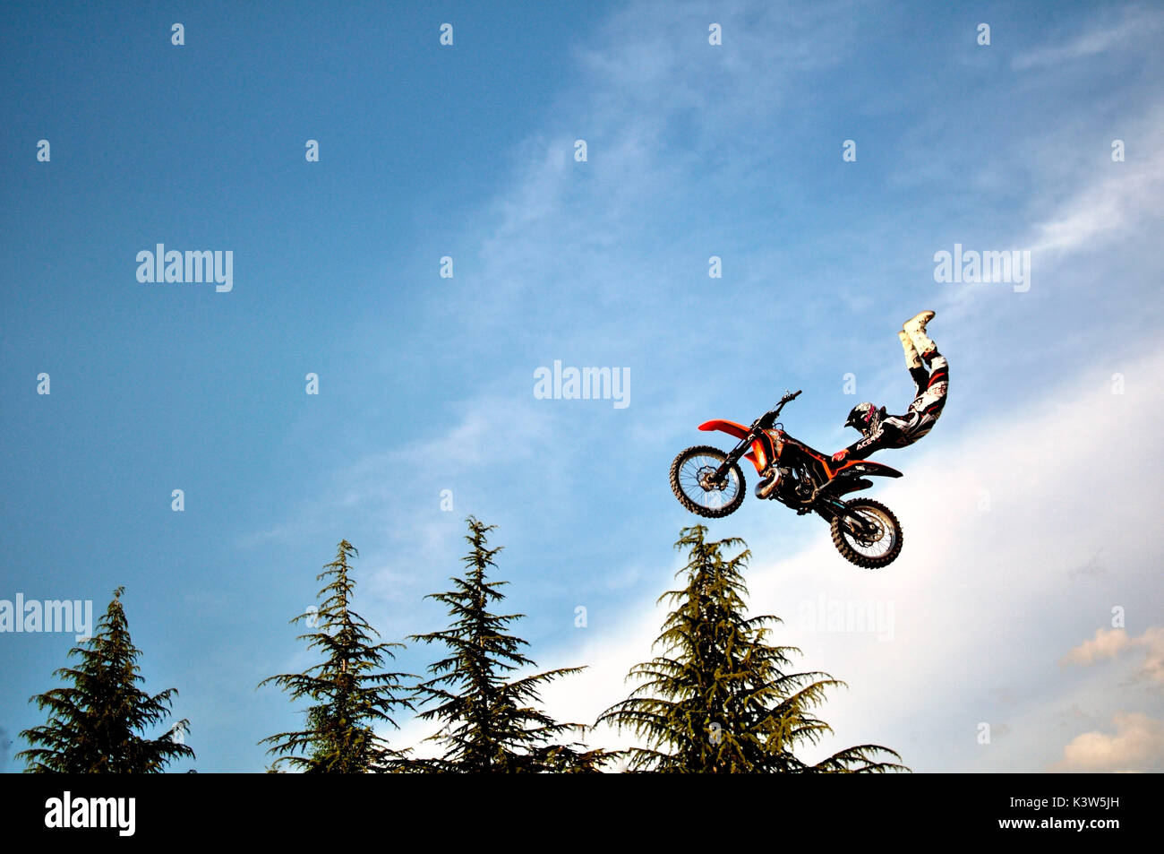 Adrenaline production of a double grab by a team of freestylers Daboot.Emilia Romagna, Italy Stock Photo