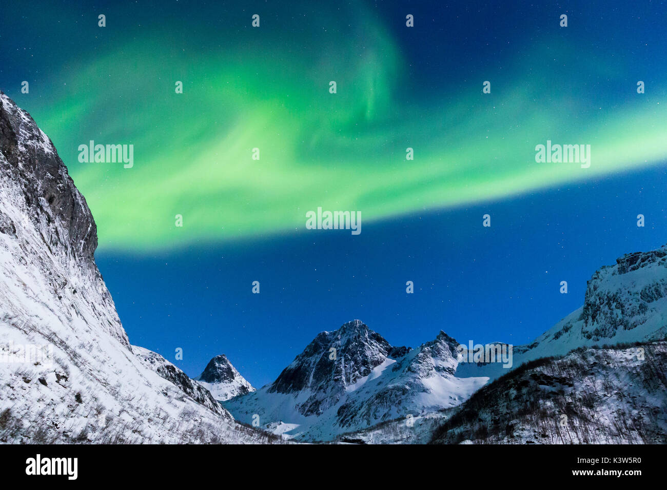Northern lights in the night sky over stormoa bergsfjorden hires stock photography and images