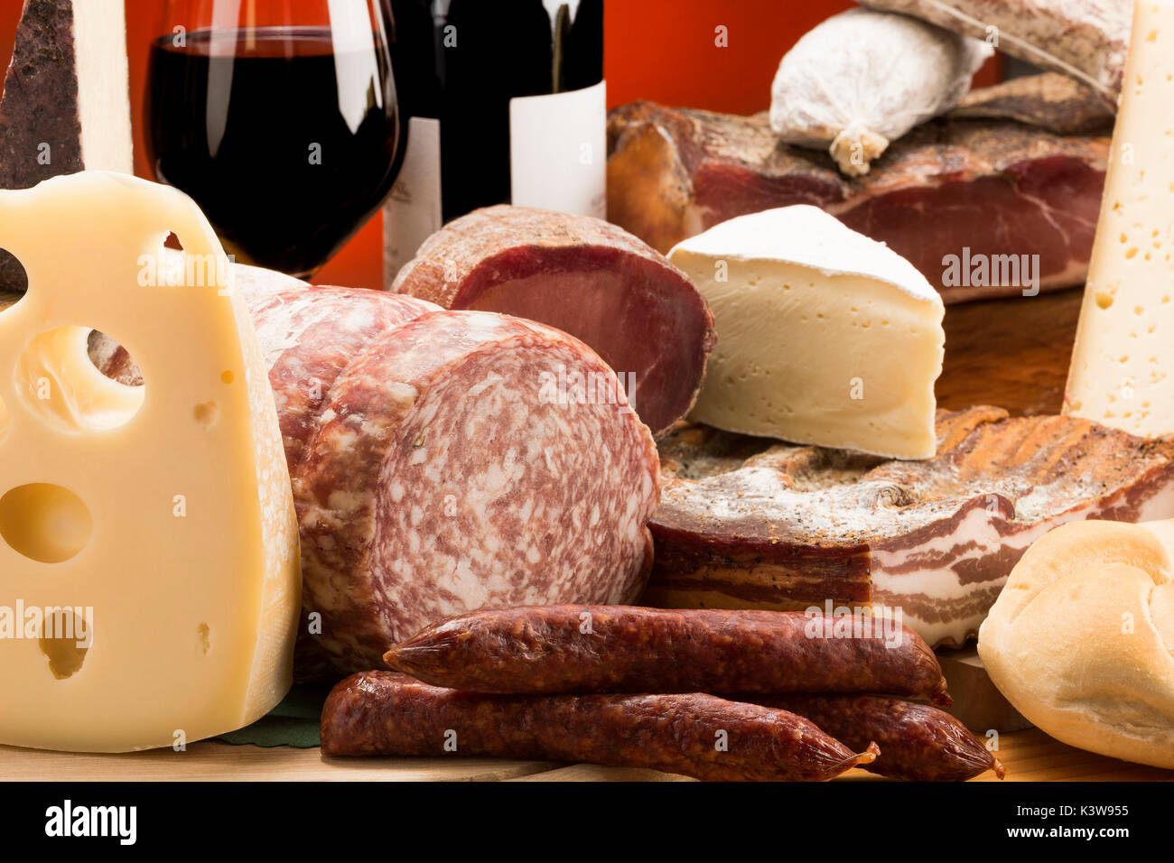 Still life, mixed salami, Mixed cheeses, typical products, red wine, Salami and cheeses, Trentino, AltoAdige, Dolomites, food, Stock Photo
