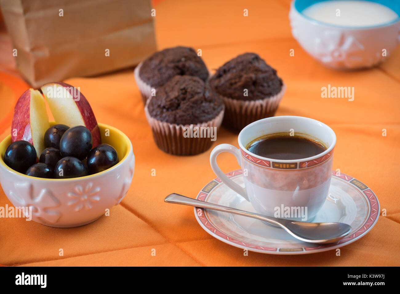 Muffins and fresh fruits Stock Photo