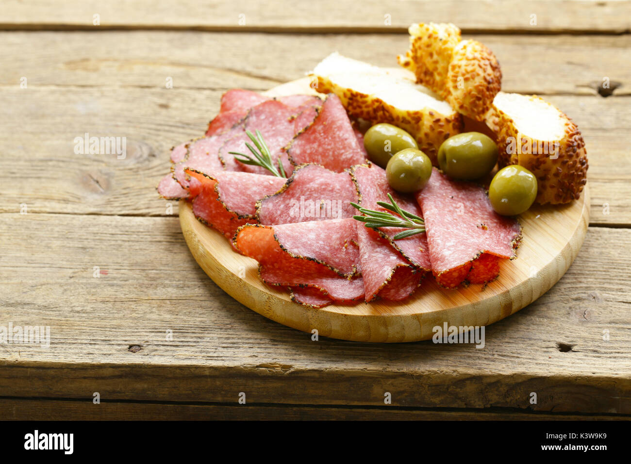 Salami pepperoni with aromatic pepper on a plate Stock Photo Alamy