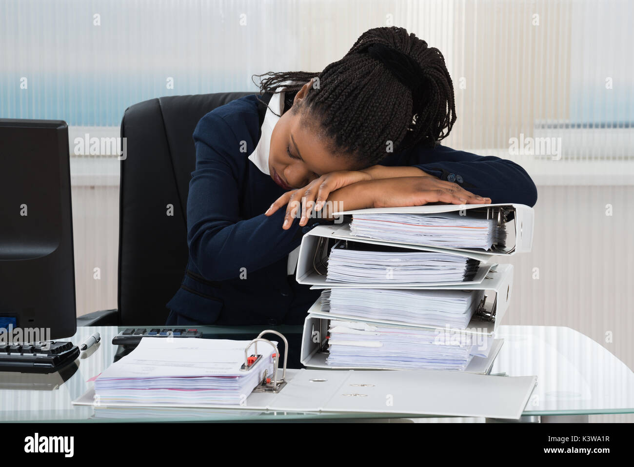 Young African Businesswoman Sleeping On Stacked Of Files Stock Photo ...