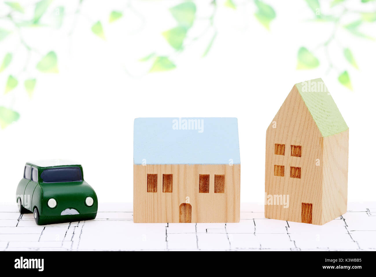 miniature model of house on blueprints, construction plan Stock Photo