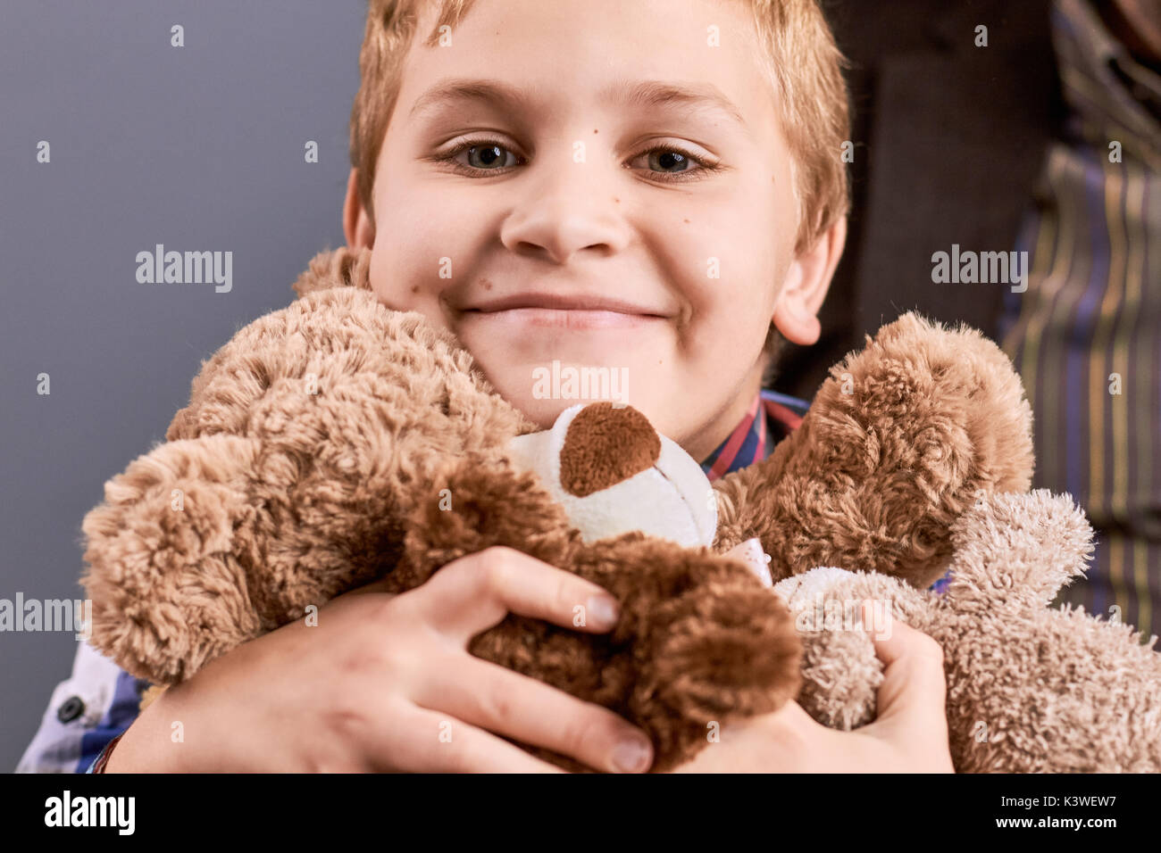 Portrait of little boy with teddy bear. Portrait of happy little boy hugging brown teddy bear